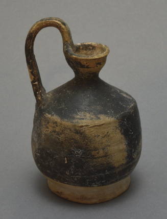 Black-glazed jug with high-swung handle