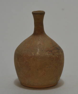Small buffware bottle with remains of black ornament on shoulder
