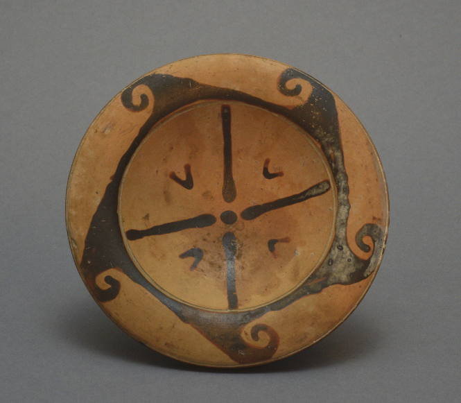 Faliscan high-fotted plate with wave border and fadiating motif