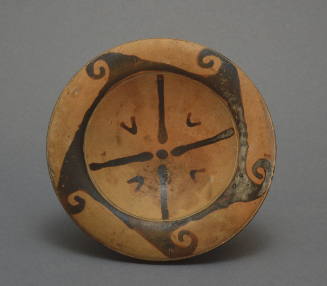 Faliscan high-fotted plate with wave border and fadiating motif