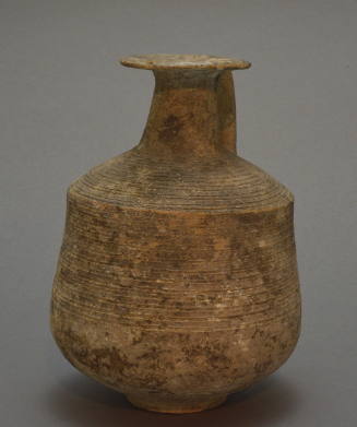 Greyware jug with wide lip, angular profile, body incised with bands; strap handle decorated with diagonal cross and painted bands