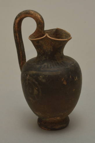 Gnathian trefoil oinochoe; standing figure and spiral decoration almost worn away, mouth damaged