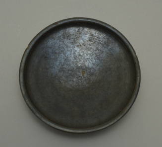 Campanian black-glazed plate on low foot; with dipinto AY
