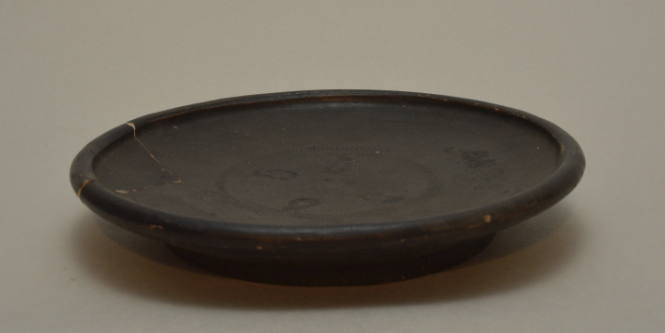 Campanian black-glazed plate with stamped palmette ornament
