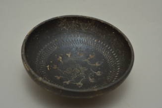 Black-glazed bowl, possibly Campanian, with stamped palmettes and rowletting in interior