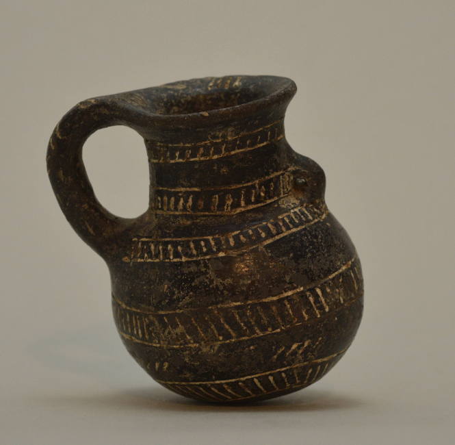Blackware juglet with incised geometric ornament