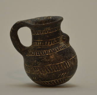 Blackware juglet with incised geometric ornament