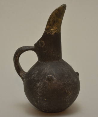 Blackware beak-spouted bottle with white-painted linear decoration and nipple attachments