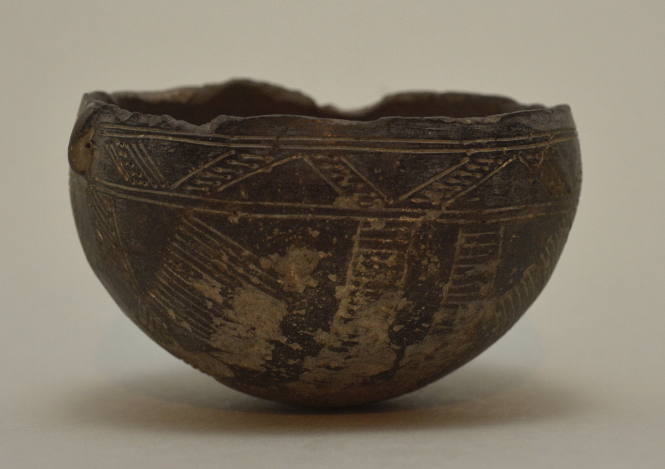 Cypriot polished blackware bowl, with incised ornament and small lug handle on side
