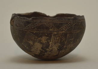 Cypriot polished blackware bowl, with incised ornament and small lug handle on side