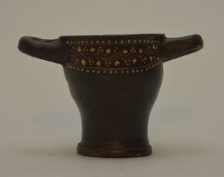 Gnathian ware skyphos, two lateral handles, decorated with ivy wreath and dots below rim