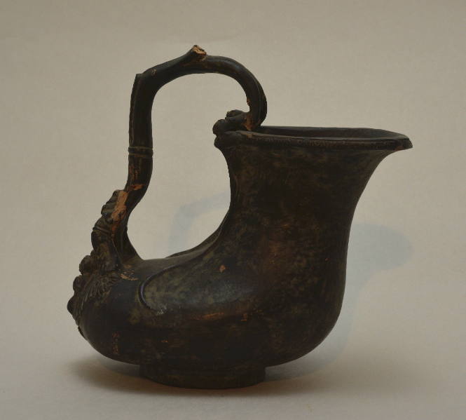 "Etruscan" askos with elaborate handle teminating in figure of cupid
