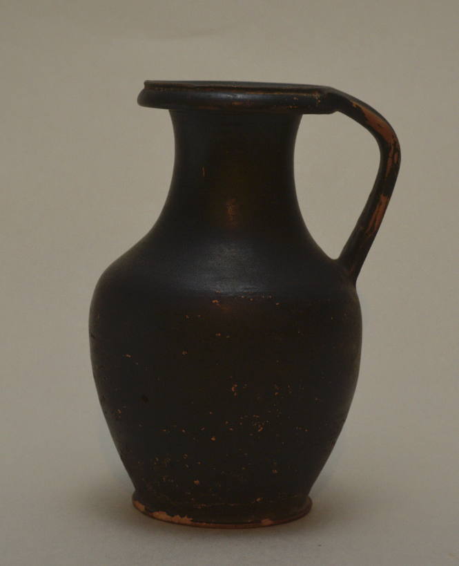 Black-glazed, olpe with everted rim and ribbed handle