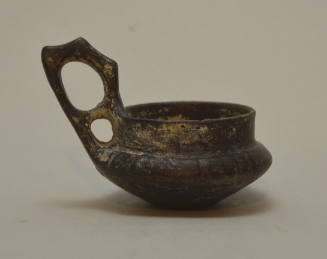 Etruscan (?) bucchero shallow cup, with high "double handle" and ribbed shoulder