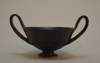 Etruscan bucchero kantharos, two igh handles; notched ridge on exterior