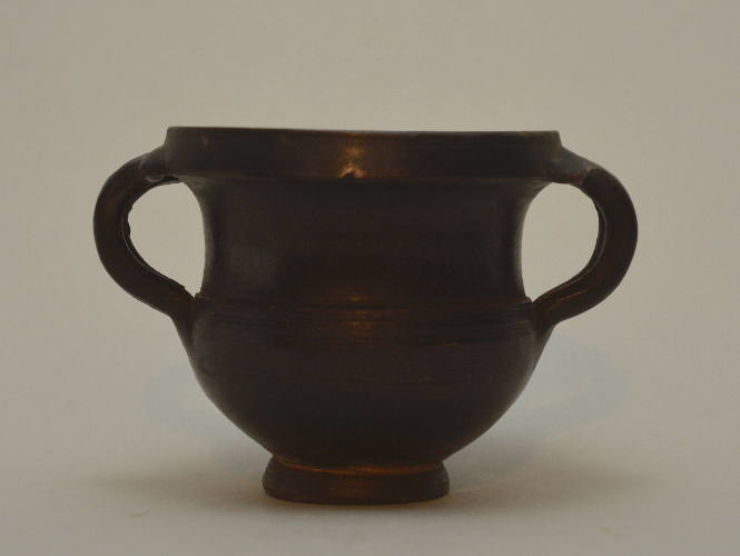 Black-glazed kantharos with twin double handles and overhanging rim
