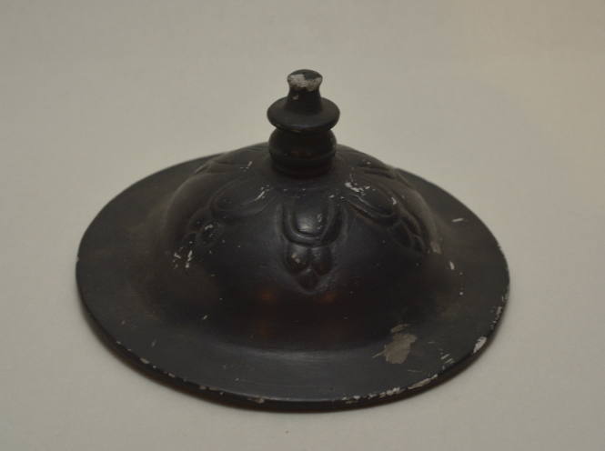 "Bucchero ware" lid with relief floral decoration