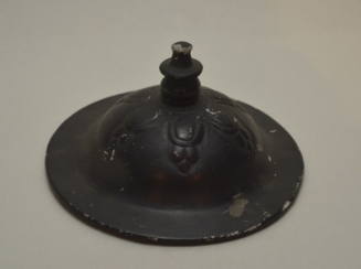 "Bucchero ware" lid with relief floral decoration