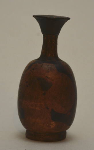 Red-figure squat lekythos with female head
