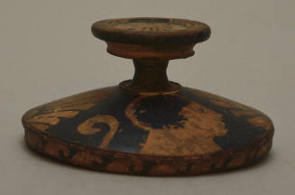 South ITalian red-figure lekanis lid; painted with profile heads and palmettes