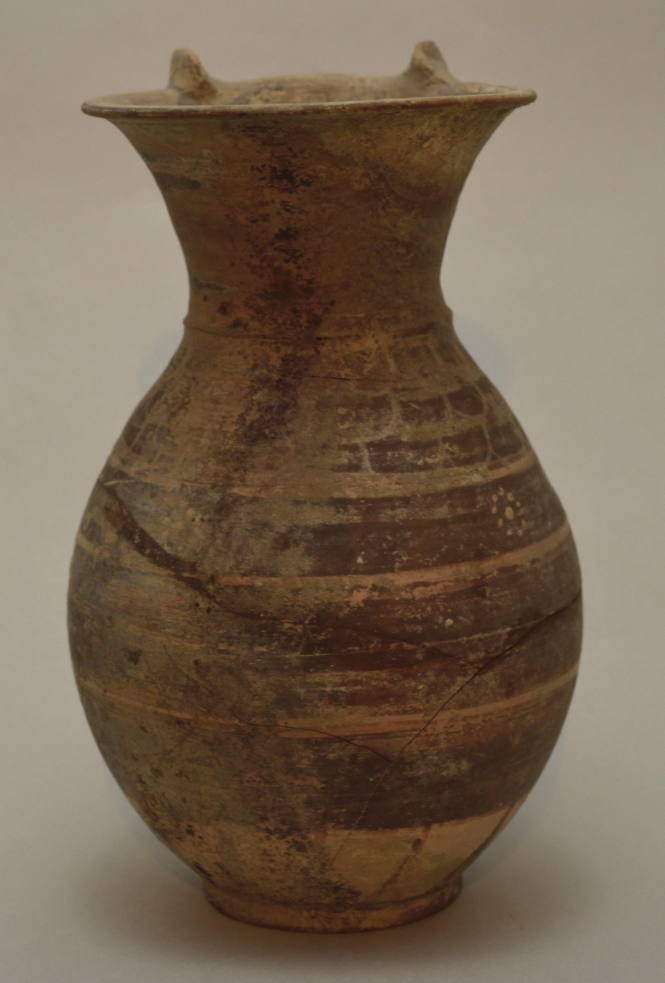 Italo-Corinthian olpe ornament with bands and scale decoration, rotelles flanking the handle on the rim