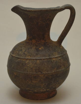 Etruscan bucchero oinochoe with pinched spout, stray handle and raised encircling ridges