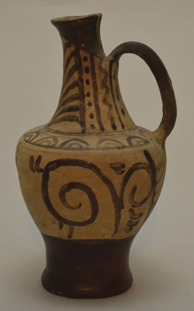 Faliscan oinochoe, spout cut away in back; with black foliate ornament on cream ground