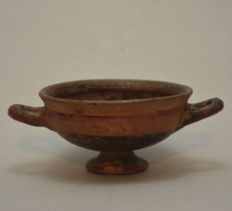Kylix with foot, ornamented with reserved band beneath the rim on the interior