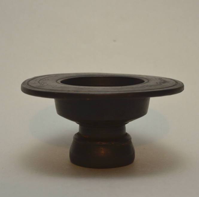 Lidded lekane, with pedestal foot and disk rim, incised with scrolling tendrils