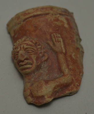 Fragment of vase, probably a rhyton, with grotesque figure