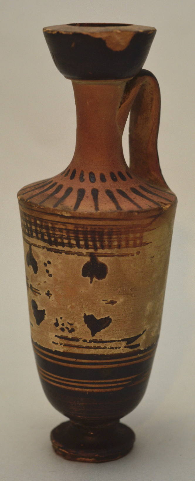 Attic black-figure lekythos ornamented with ivy-wreathand cross bars