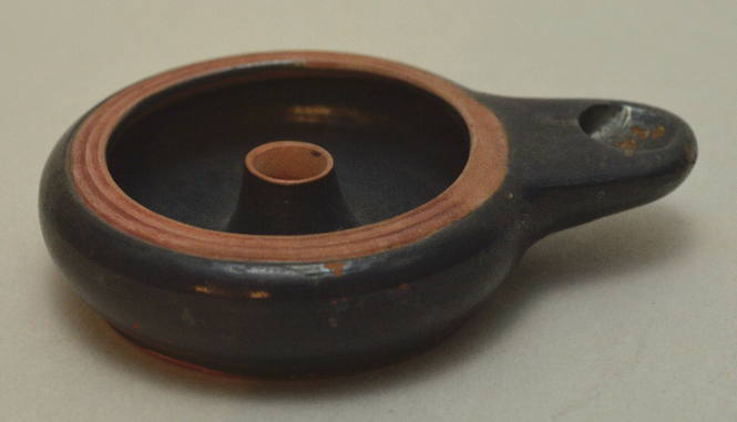Black-glazed pottery lamp