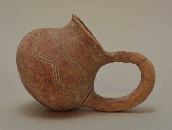 Redware juglet with incised ornament