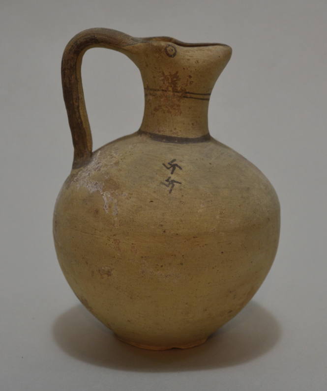 Roman red-glazed pottery bowl ornamented with rouletting and an applied spiral