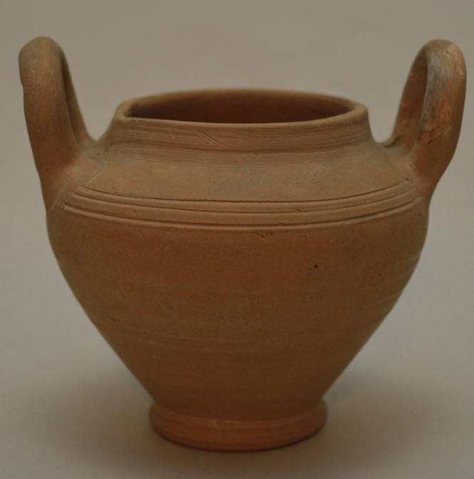 Unglazed pottery vessel with two vertical handles; incised bands around shoulder