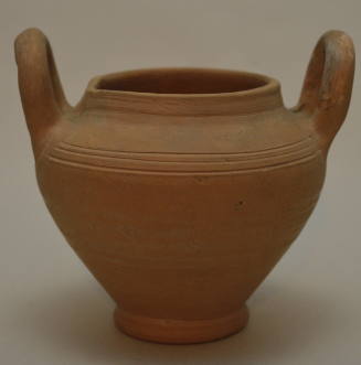 Unglazed pottery vessel with two vertical handles; incised bands around shoulder