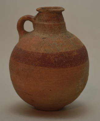 Pottery jug with globular body, one handle, short neck, decorated with one red band encircling body and red handle