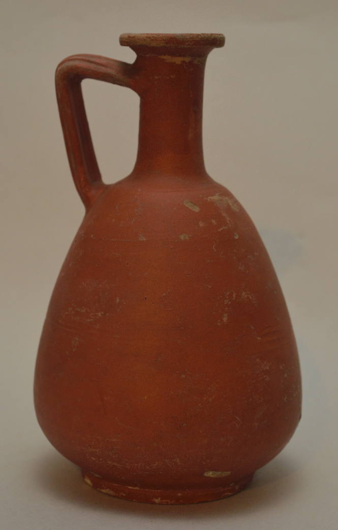 Roman red-slip jug with tapering body and angular strap handle
