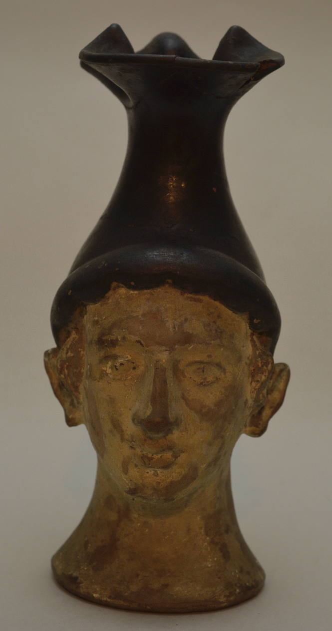 Oinochoe with form of human head