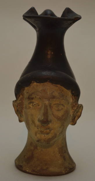 Oinochoe with form of human head