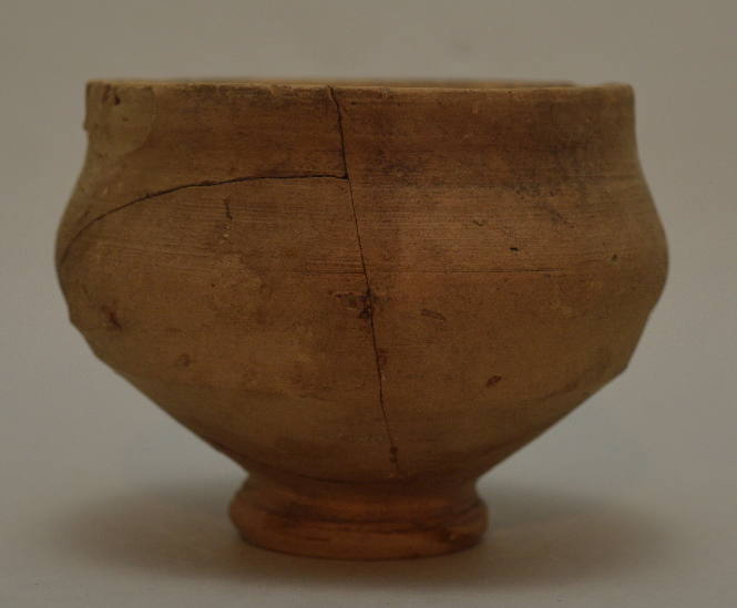 Potteru inglazed bowl on ring foot