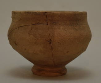 Potteru inglazed bowl on ring foot