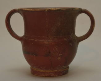 Red-glazed cup with two vertical handles