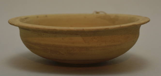 Buffware bowl with everted lip; rim pierce for suspension