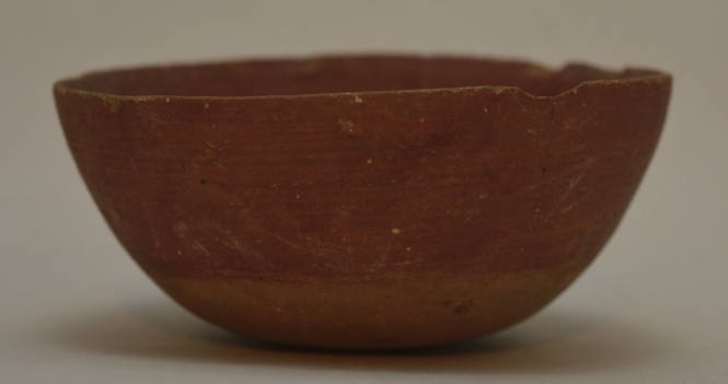 Redware bowl with round base; unglazed base