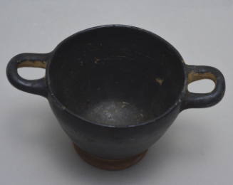 Black-glazed skyphos; reserved band around foot