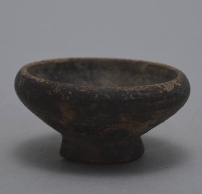 Group of miniature black-glazed votive dishes