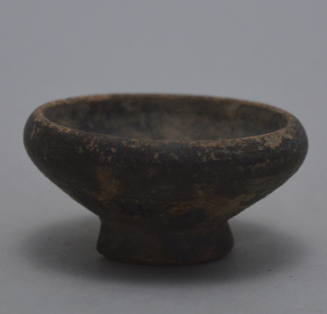 Group of miniature black-glazed votive dishes