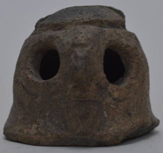 Figure of an owl with a rattle inside.