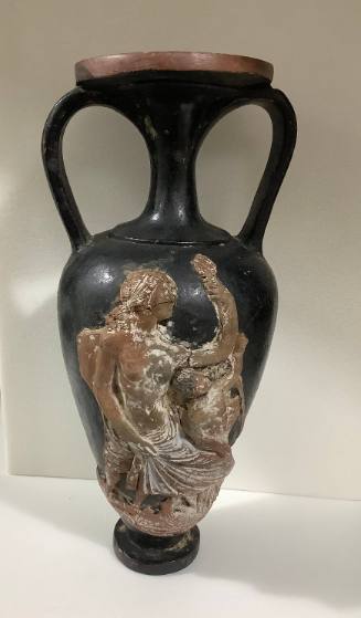 Greek black glaze amphora ornamented in terracotta relief on one side with a woman and child